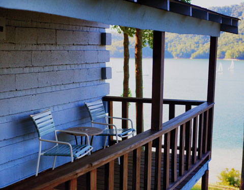 chairs on porch overlooking lake